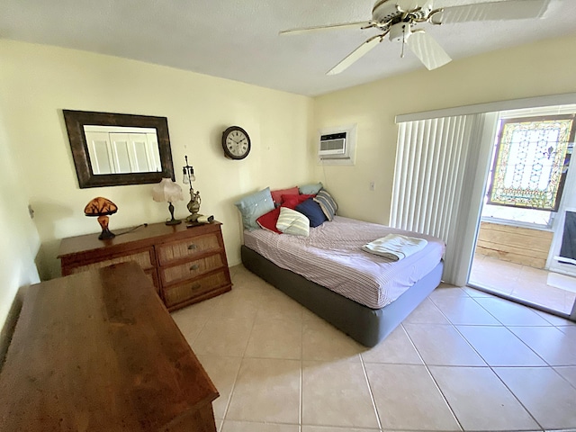 191 Durham D, Deerfield Beach, FL 33442 - bedroom featuring an AC wall unit, access to outside, light tile patterned floors, and a ceiling fan
