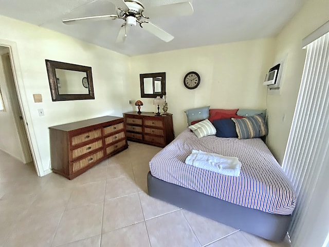 191 Durham D, Deerfield Beach, FL 33442 - bedroom featuring light tile patterned floors, a ceiling fan, and a wall mounted AC