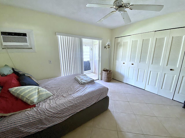 191 Durham D, Deerfield Beach, FL 33442 - bedroom with a closet, a wall mounted air conditioner, a textured ceiling, light tile patterned flooring, and ceiling fan