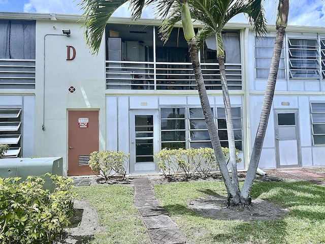 191 Durham D, Deerfield Beach, FL 33442 - doorway to property featuring stucco siding