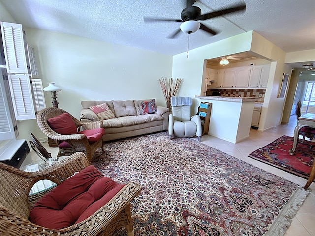 191 Durham D, Deerfield Beach, FL 33442 - living area featuring a textured ceiling, a ceiling fan, and light tile patterned flooring