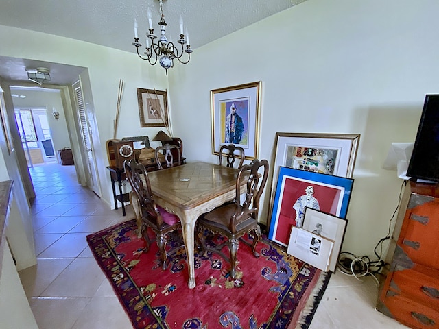 191 Durham D, Deerfield Beach, FL 33442 - dining room with a textured ceiling, light tile patterned floors, and an inviting chandelier