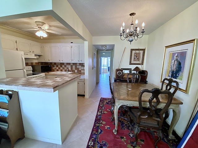 191 Durham D, Deerfield Beach, FL 33442 - kitchen with tasteful backsplash, a sink, white appliances, white cabinetry, and light tile patterned flooring
