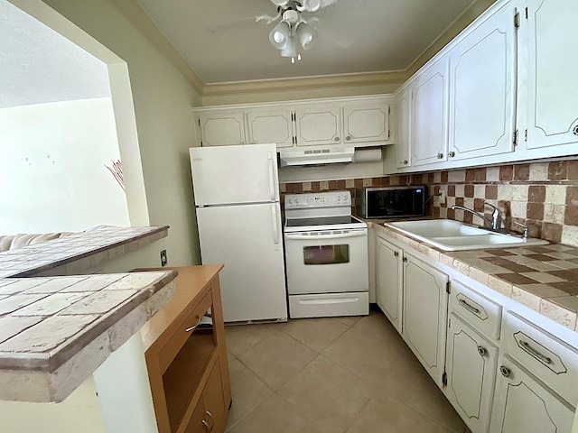 191 Durham D, Deerfield Beach, FL 33442 - kitchen with tile countertops, white appliances, white cabinets, under cabinet range hood, and a sink