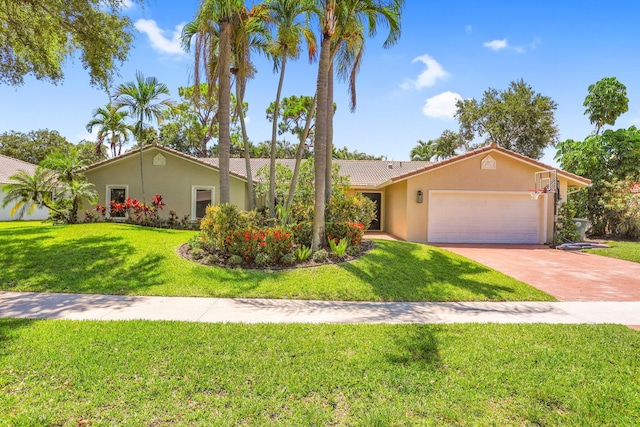 6769 Entrada Pl, Boca Raton, FL 33433 - view of front of house featuring stucco siding, a garage, a front yard, concrete driveway, and a tiled roof