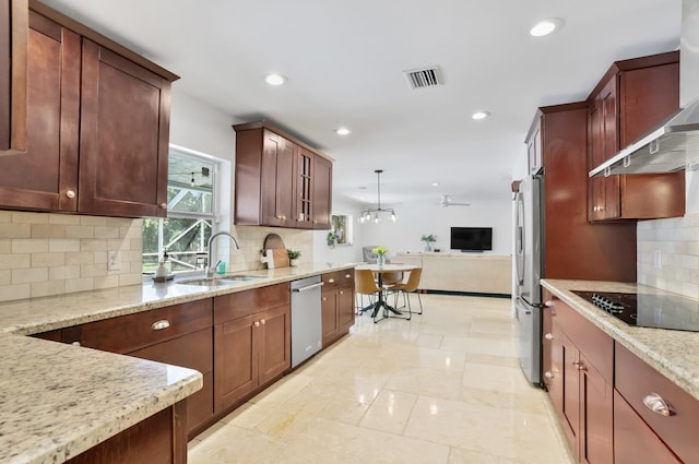6769 Entrada Pl, Boca Raton, FL 33433 - kitchen featuring appliances with stainless steel finishes, open floor plan, a sink, light stone countertops, and tasteful backsplash