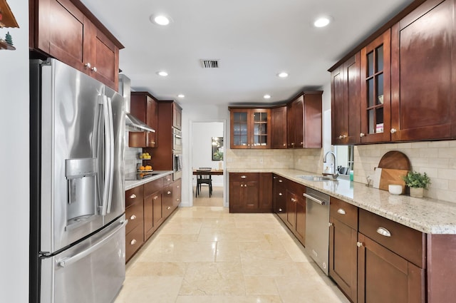 6769 Entrada Pl, Boca Raton, FL 33433 - kitchen with stainless steel appliances, a sink, recessed lighting, light stone countertops, and decorative backsplash
