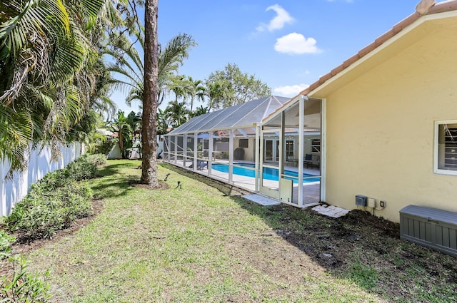 6769 Entrada Pl, Boca Raton, FL 33433 - view of yard featuring an outdoor pool and glass enclosure