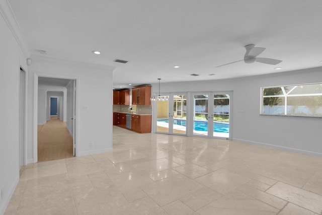 6769 Entrada Pl, Boca Raton, FL 33433 - unfurnished living room featuring recessed lighting, crown molding, a ceiling fan, and a chandelier