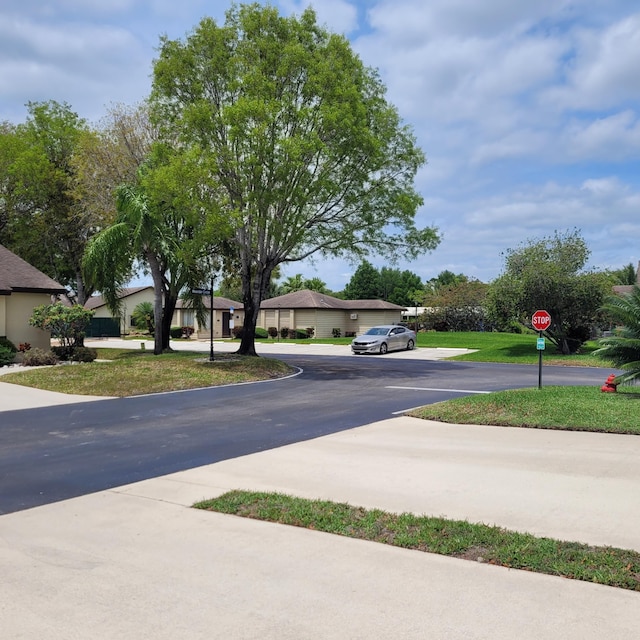 135 Meander Cir, Royal Palm Beach, FL 33411 - view of street featuring traffic signs