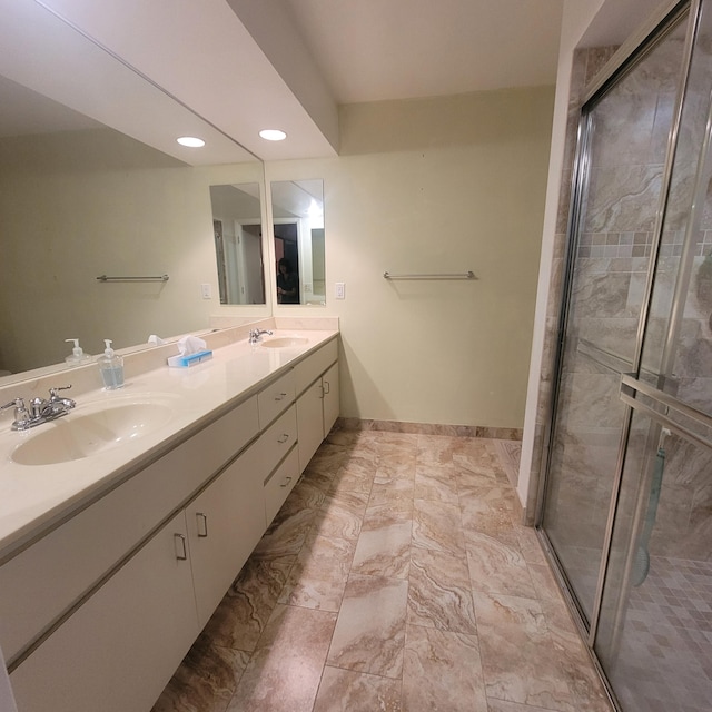 135 Meander Cir, Royal Palm Beach, FL 33411 - full bath with recessed lighting, a sink, a shower stall, double vanity, and baseboards