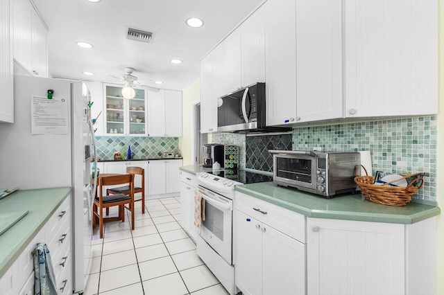 1440 SW 5th Ave, Boca Raton, FL 33432 - bedroom with ceiling fan, baseboards, and light wood-type flooring