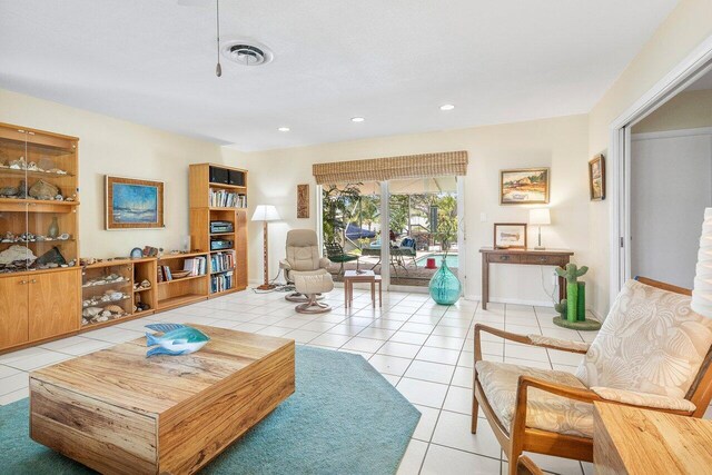 1440 SW 5th Ave, Boca Raton, FL 33432 - living area featuring visible vents, ceiling fan, light tile patterned flooring, and plenty of natural light