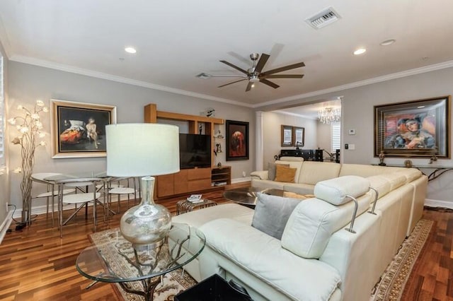 310 E Mallory Cir, Delray Beach, FL 33483 - living area with crown molding, ceiling fan with notable chandelier, visible vents, wood finished floors, and baseboards