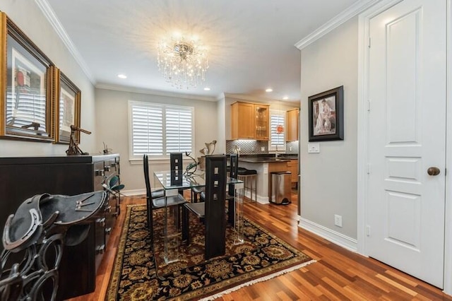 310 E Mallory Cir, Delray Beach, FL 33483 - dining area with wood finished floors, baseboards, and ornamental molding