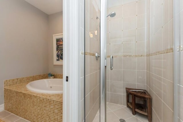 310 E Mallory Cir, Delray Beach, FL 33483 - full bath featuring tile patterned flooring, a garden tub, and a stall shower