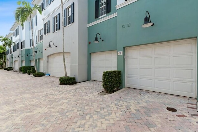310 E Mallory Cir, Delray Beach, FL 33483 - exterior space with a garage and decorative driveway