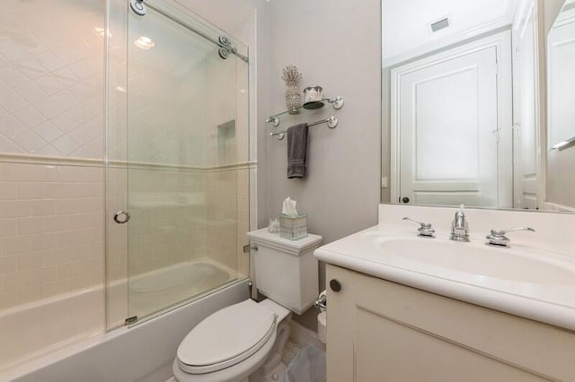310 E Mallory Cir, Delray Beach, FL 33483 - full bath featuring visible vents, toilet, vanity, and shower / bath combination with glass door