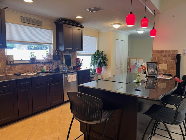 1380 SW 1st St, Boca Raton, FL 33486 - kitchen with dishwasher, ornamental molding, tasteful backsplash, a kitchen bar, and light tile patterned floors
