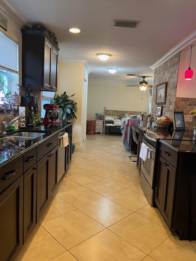 1380 SW 1st St, Boca Raton, FL 33486 - kitchen featuring crown molding, appliances with stainless steel finishes, dark countertops, open floor plan, and light tile patterned floors
