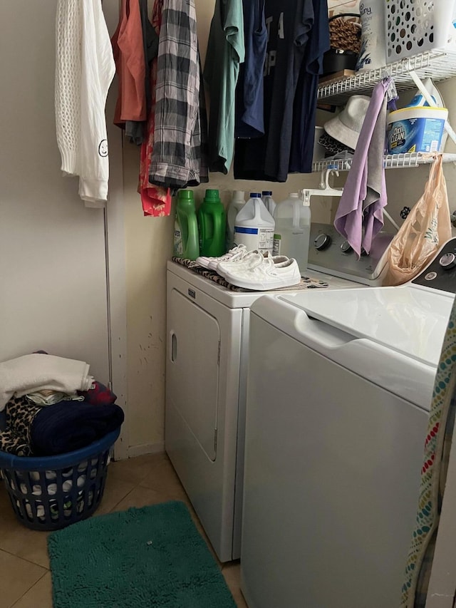 1380 SW 1st St, Boca Raton, FL 33486 - laundry room featuring washer and dryer and light tile patterned floors