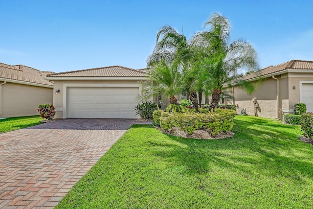 9068 Clearhill Rd, Boynton Beach, FL 33473 - mediterranean / spanish house with stucco siding, decorative driveway, and a tile roof