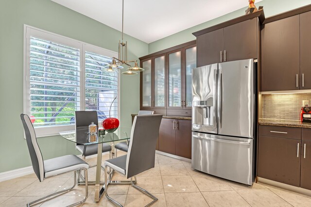 9068 Clearhill Rd, Boynton Beach, FL 33473 - dining room with a chandelier and light tile patterned floors