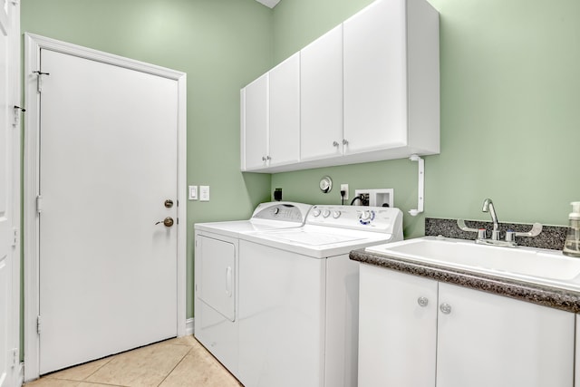 9068 Clearhill Rd, Boynton Beach, FL 33473 - washroom featuring washer and dryer, light tile patterned flooring, a sink, and cabinet space