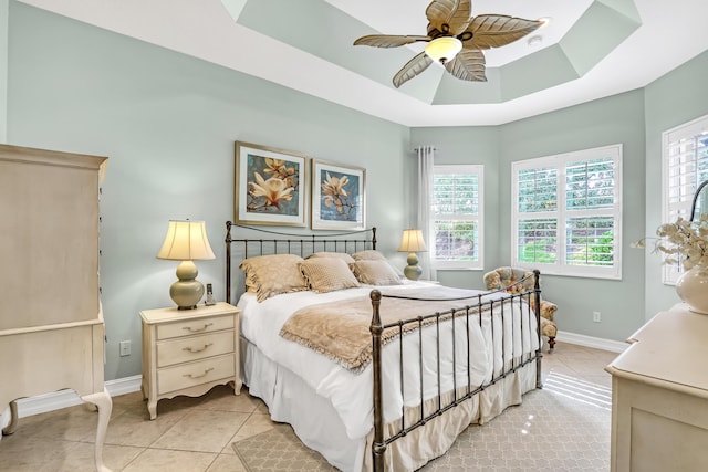 9068 Clearhill Rd, Boynton Beach, FL 33473 - bedroom featuring light tile patterned floors, baseboards, a ceiling fan, and a raised ceiling