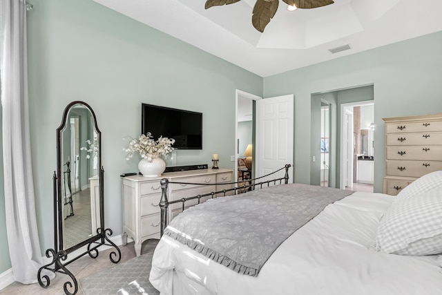 9068 Clearhill Rd, Boynton Beach, FL 33473 - bedroom with ceiling fan, light tile patterned floors, visible vents, a raised ceiling, and baseboards