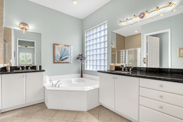 9068 Clearhill Rd, Boynton Beach, FL 33473 - bathroom with a sink, two vanities, a shower stall, and a garden tub