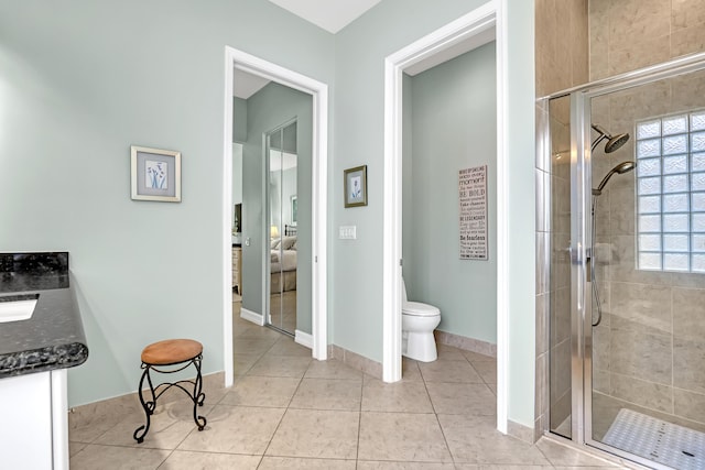 9068 Clearhill Rd, Boynton Beach, FL 33473 - bathroom with a shower stall, tile patterned floors, vanity, and toilet