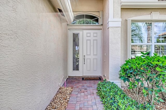 9068 Clearhill Rd, Boynton Beach, FL 33473 - doorway to property with stucco siding