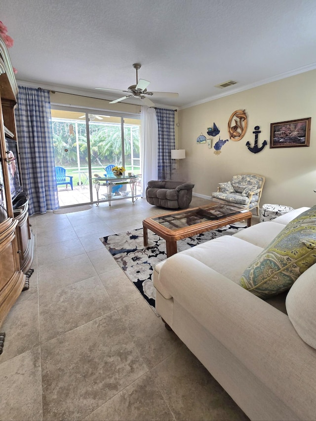 630 SW Treasure Cv, Port Saint Lucie, FL 34953 - living room featuring visible vents, ornamental molding, and ceiling fan