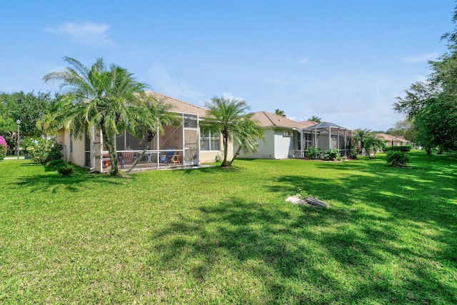 630 SW Treasure Cv, Port Saint Lucie, FL 34953 - view of yard with glass enclosure