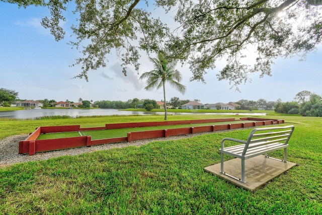 630 SW Treasure Cv, Port Saint Lucie, FL 34953 - view of home's community with a water view and a yard