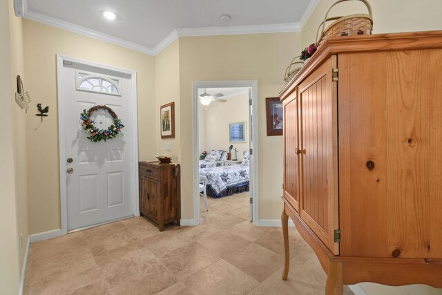 630 SW Treasure Cv, Port Saint Lucie, FL 34953 - foyer entrance featuring crown molding and baseboards