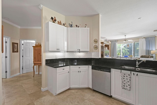 630 SW Treasure Cv, Port Saint Lucie, FL 34953 - kitchen with decorative backsplash, dishwasher, a sink, open floor plan, and white cabinetry