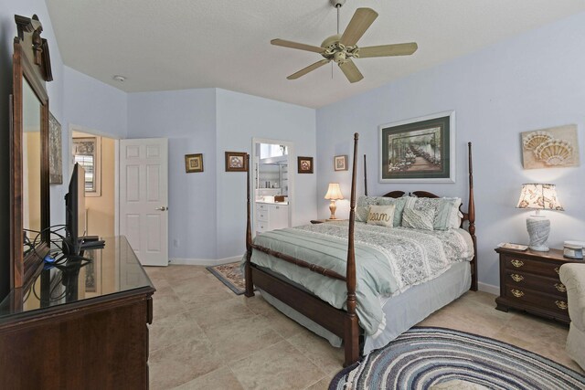 630 SW Treasure Cv, Port Saint Lucie, FL 34953 - bedroom with a ceiling fan, baseboards, and ensuite bath