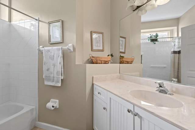 630 SW Treasure Cv, Port Saint Lucie, FL 34953 - bathroom featuring vanity, baseboards, and shower / bath combo with shower curtain
