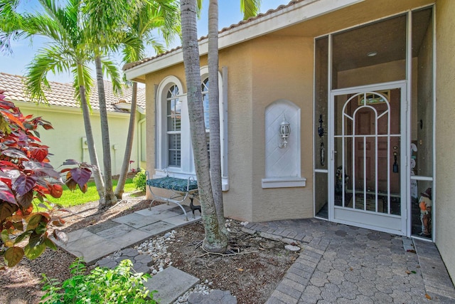 630 SW Treasure Cv, Port Saint Lucie, FL 34953 - view of exterior entry with stucco siding