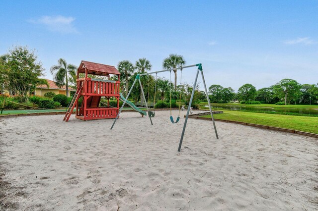 630 SW Treasure Cv, Port Saint Lucie, FL 34953 - community play area featuring a yard and a water view