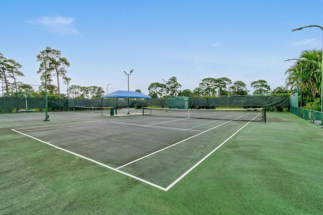 630 SW Treasure Cv, Port Saint Lucie, FL 34953 - view of sport court featuring fence
