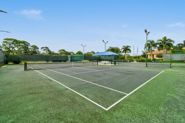 630 SW Treasure Cv, Port Saint Lucie, FL 34953 - view of sport court with fence