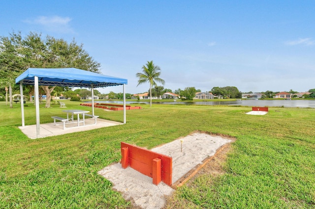 630 SW Treasure Cv, Port Saint Lucie, FL 34953 - exterior space featuring a gazebo, a water view, and a lawn