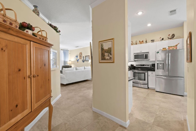 630 SW Treasure Cv, Port Saint Lucie, FL 34953 - hall with recessed lighting, baseboards, visible vents, and light tile patterned floors