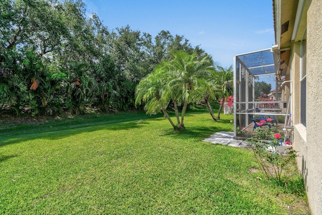 630 SW Treasure Cv, Port Saint Lucie, FL 34953 - view of yard with a lanai