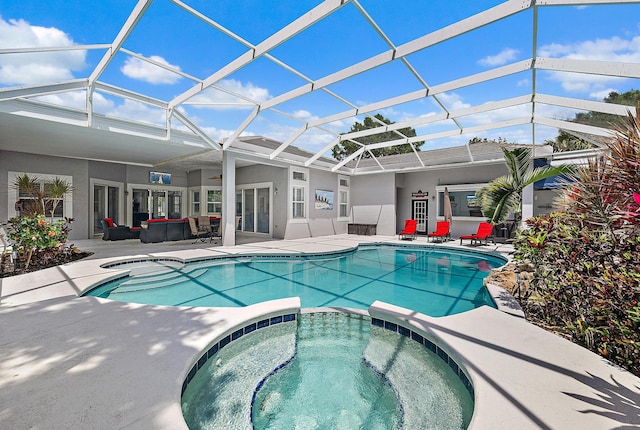view of swimming pool with a lanai, a patio area, and a pool with connected hot tub