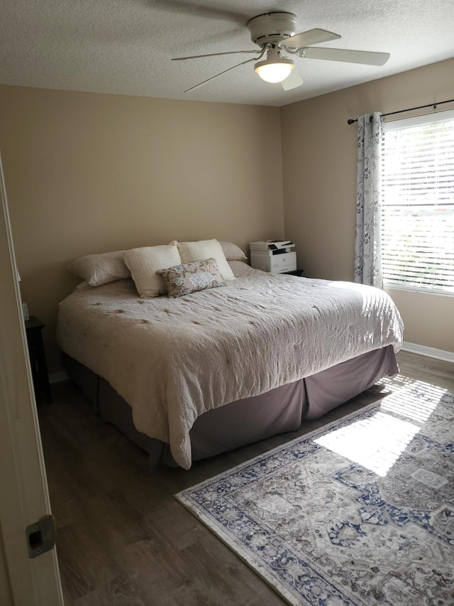 2831 Stoneway Ln Unit C, Fort Pierce, FL 34982 - bedroom featuring a textured ceiling, wood finished floors, and ceiling fan