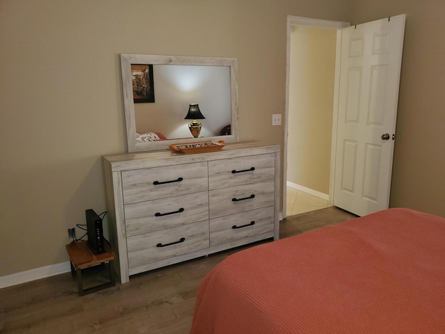 2831 Stoneway Ln Unit C, Fort Pierce, FL 34982 - bedroom featuring baseboards and wood finished floors